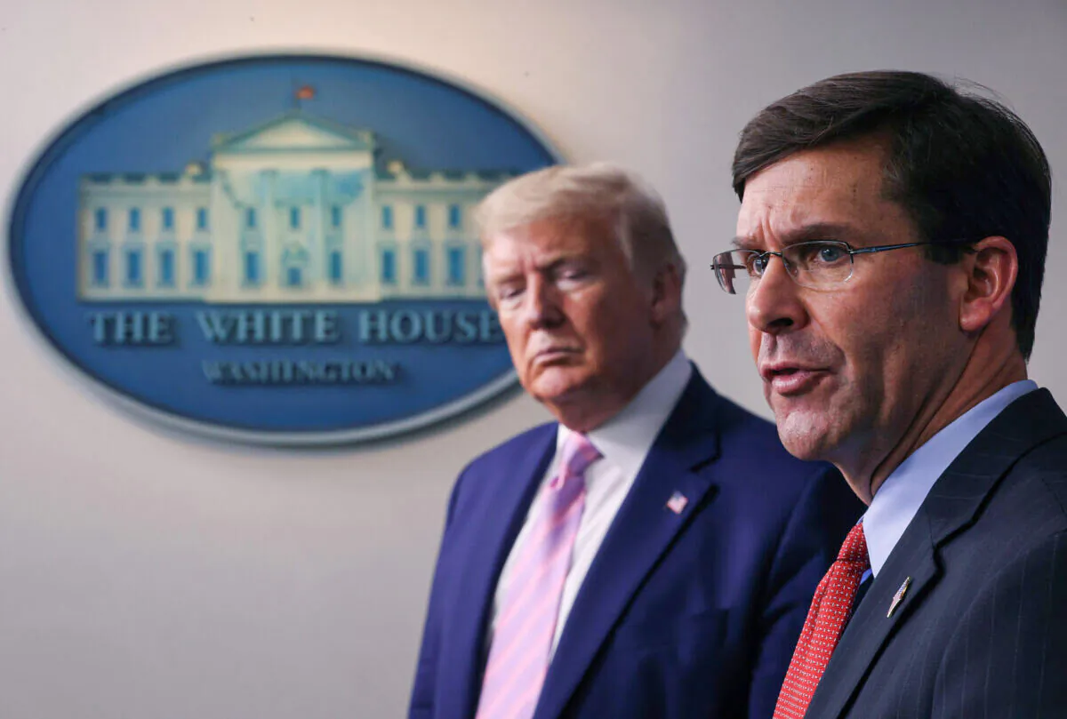 Secretary of Defense Mark Esper speaks as U.S. President Donald Trump listens during the daily White House coronavirus press briefing in Washington on April 1, 2020. (Win McNamee/Getty Images)