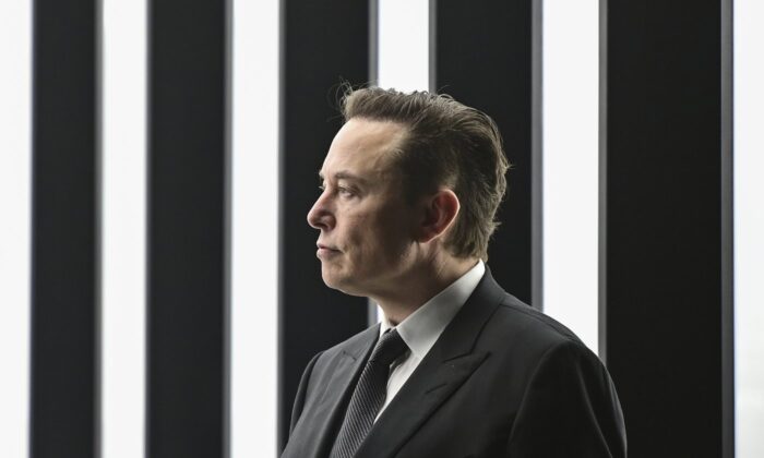 Elon Musk, Tesla CEO, attends the opening of the Tesla factory Berlin Brandenburg in Gruenheide, Germany, March 22, 2022. (Pool via AP/Patrick Pleul)