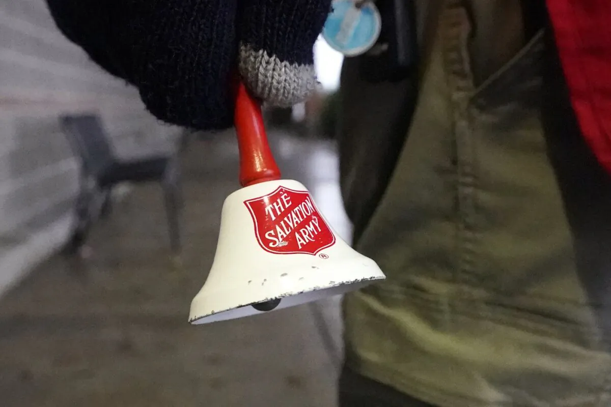 A Salvation Army bell is rung in front of a grocery store, in Lynden, Wash., on Dec. 8, 2020. (The Canadian Press/AP/Elaine Thompson)