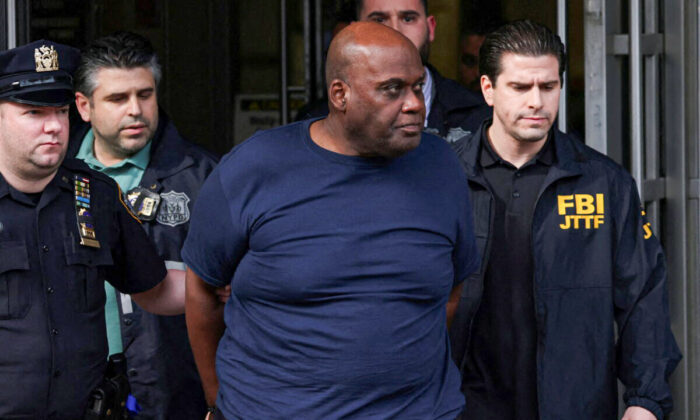 Frank James, the suspect in the Brooklyn subway shooting walks outside a police precinct in New York City on April 13, 2022. (Andrew Kelly/Reuters)