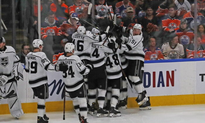 Los Angeles Kings players celebrate a goal by forward Adrian Kempe (9) against the Edmonton Oilers during overtime in game five of the first round of the 2022 Stanley Cup Playoffs at Rogers Place, in Edmonton, Alberta, Canada, on May 10, 2022. (Perry Nelson/USA TODAY Sports via Field Level Media)