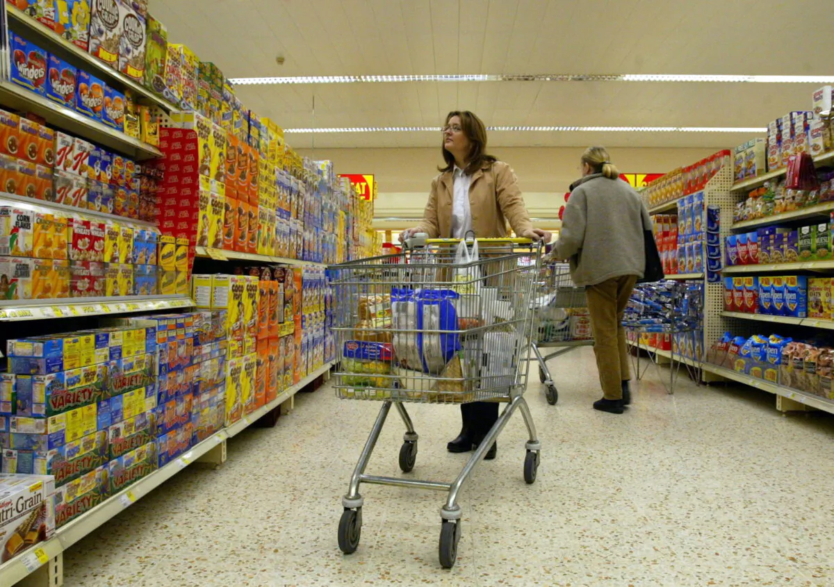 Shoppers are seen in a supermarket aisle in this file photo. (Martin Rickett/PA)