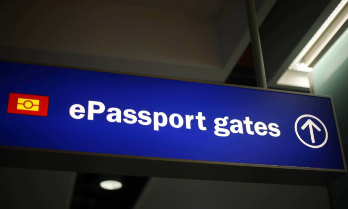 Undated photo of signage for passport gates at an airport. (Steve Parsons/PA)