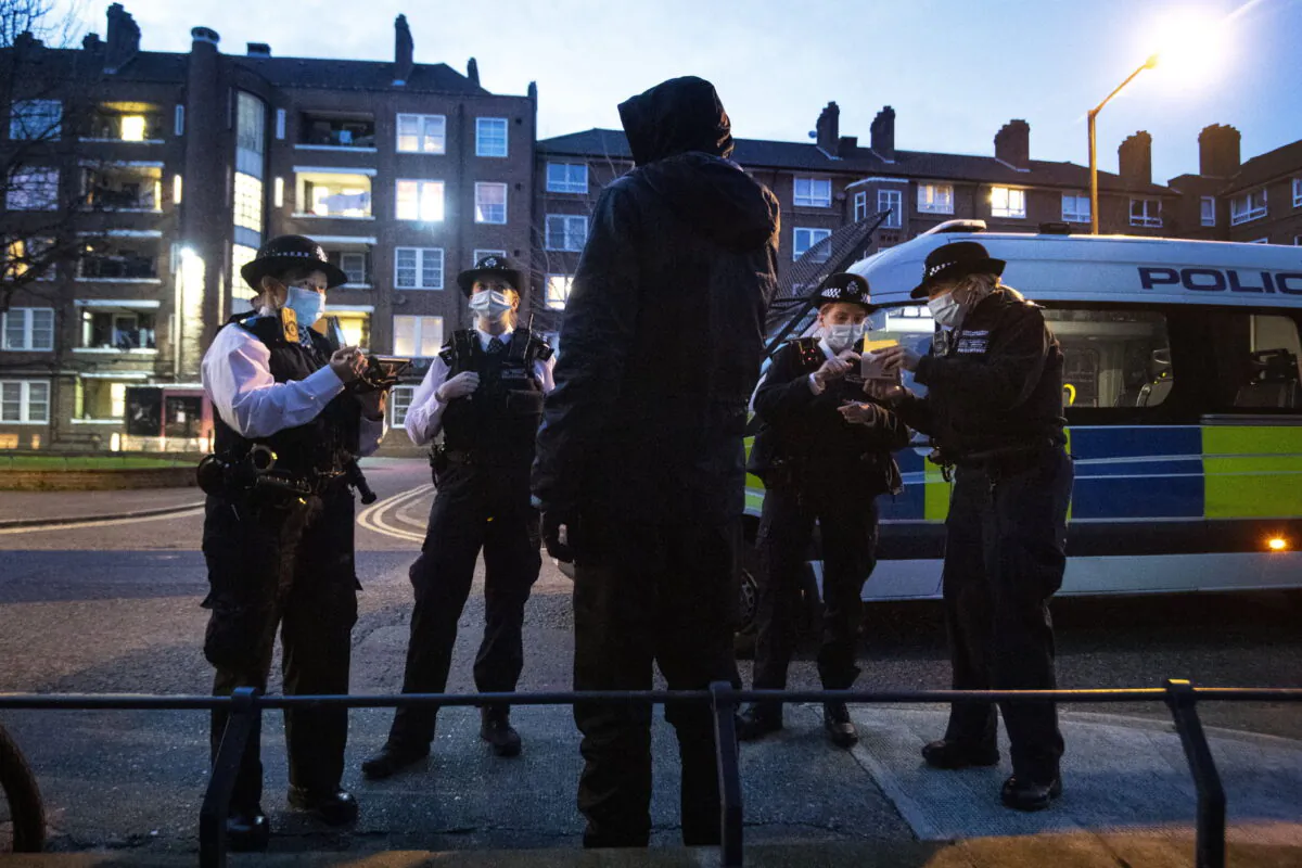 Undated photograph of police carrying out a stop-and-search in London. (Victoria Jones/PA)