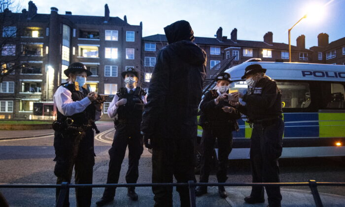 Undated photograph of police carrying out a stop-and-search in London. (Victoria Jones/PA)