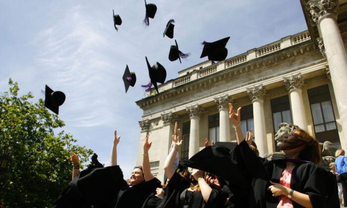 Stock image of graduates throwing their caps in celebration (Archive/PA)