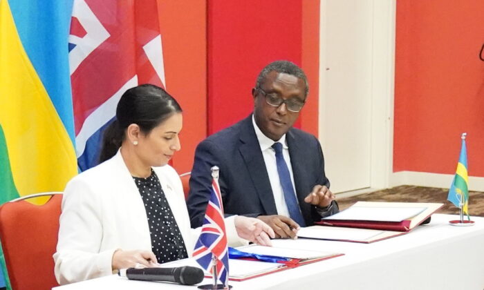 British Home Secretary Priti Patel and Rwandan minister for foreign affairs and international co-operation, Vincent Biruta, signed a "world-first" migration and economic development partnership in the East African nation's capital city Kigali, on April 14, 2022. (Flora Thompson/PA)