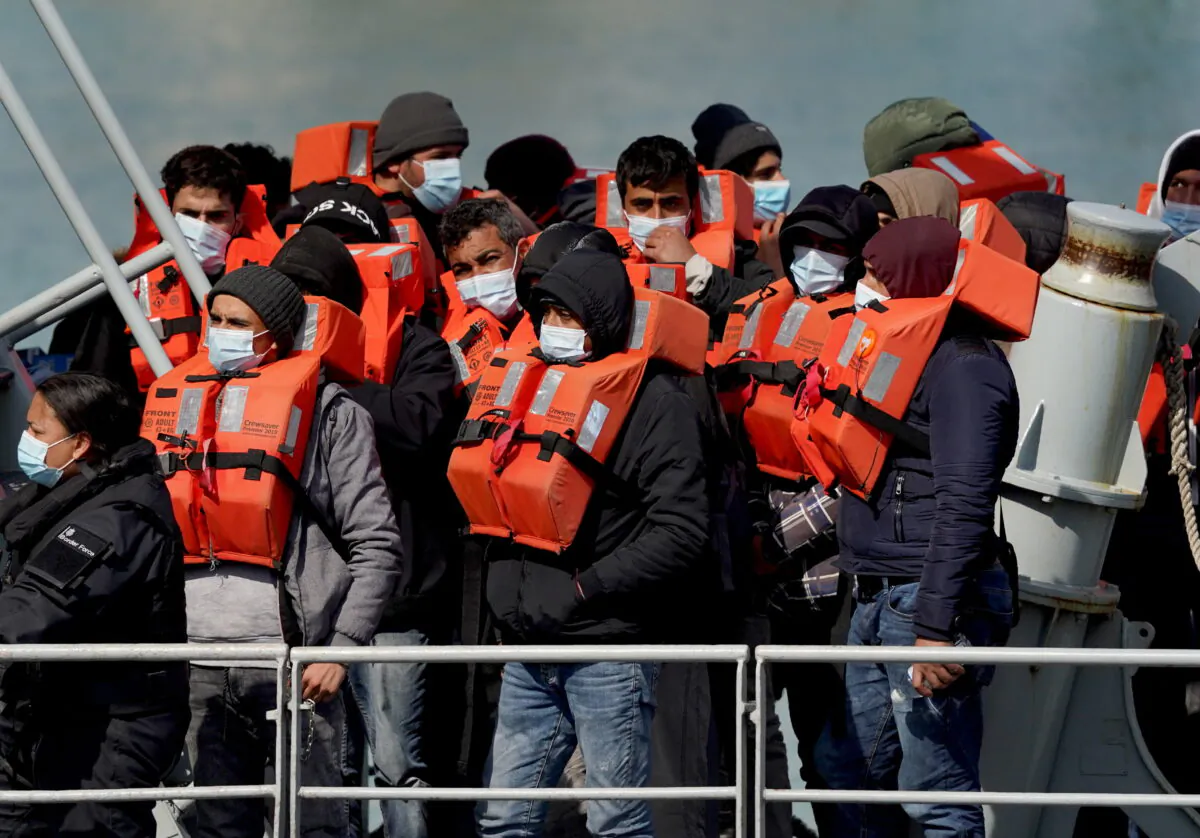 Undated file photo showing a group of people thought to be illegal immigrants in Dover, Kent, England. (Gareth Fuller/PA Media)