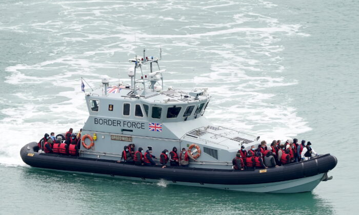 Undated photo showing group of people thought to be migrants are brought in to Dover, Kent, on board a Border Force vessel. (Gareth Fuller/PA Media)