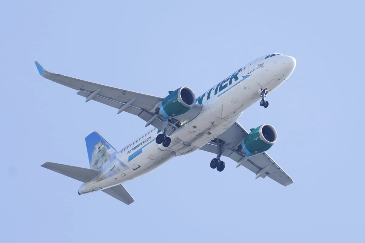 A Frontier Airlines aircraft flying over Gloster City, N.J., approaches Philadelphia International Airport, on Oct. 22, 2021. (Matt Rourke/AP Photo)