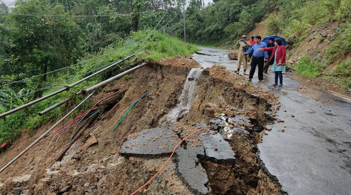 People inspect the area of a landslide after heavy rainfall in Dima Hasao district, in the northeastern Indian state of Assam, on May 16, 2022. (Dima Hasao district administration via AP)