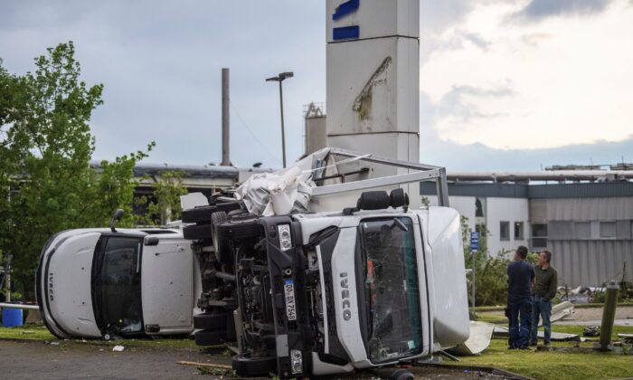 Two trucks overturned after a storm in Paderborn, Germany, on May 20, 2022. (Lino Mirgeler/dpa via AP)