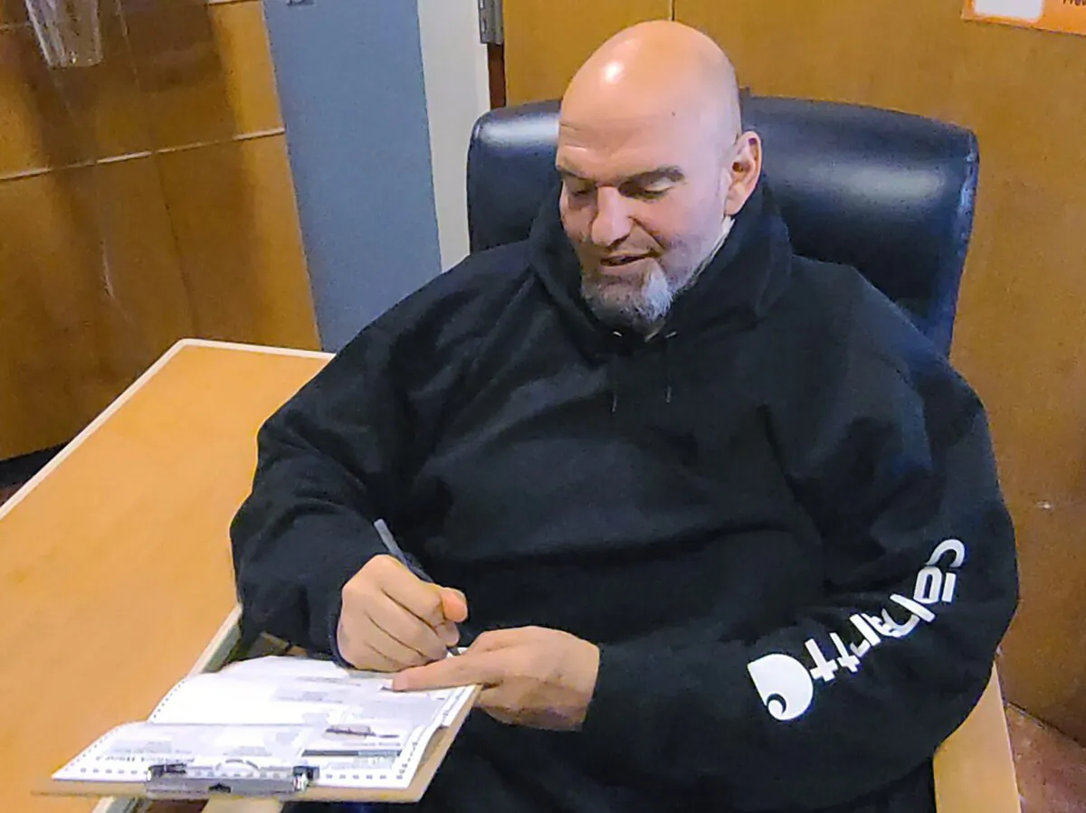 John Fetterman fills out his emergency absentee ballot for the Pennsylvania primary election in Penn Medicine Lancaster General Hospital in Lancaster, Pa., on May, 17, 2022. (Bobby Maggio via AP)