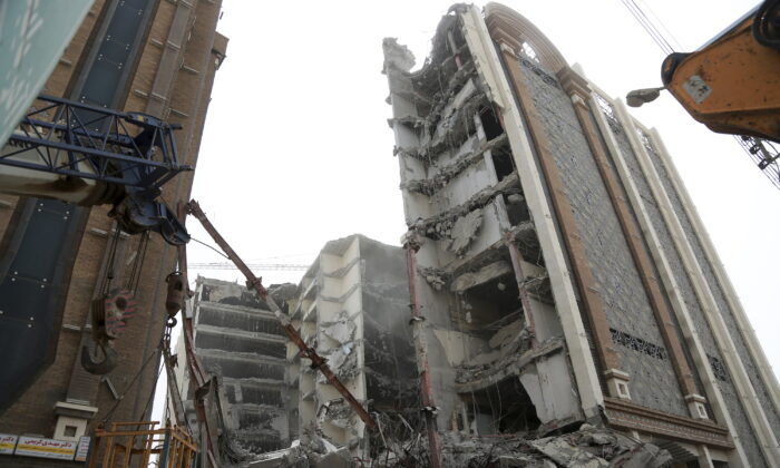 A 10-story commercial building under construction collapsed killing several people in the southwestern city of Abadan, Iran, on May 23, 2022. (Mohammad Amin Ansari, Fars News Agency via AP)