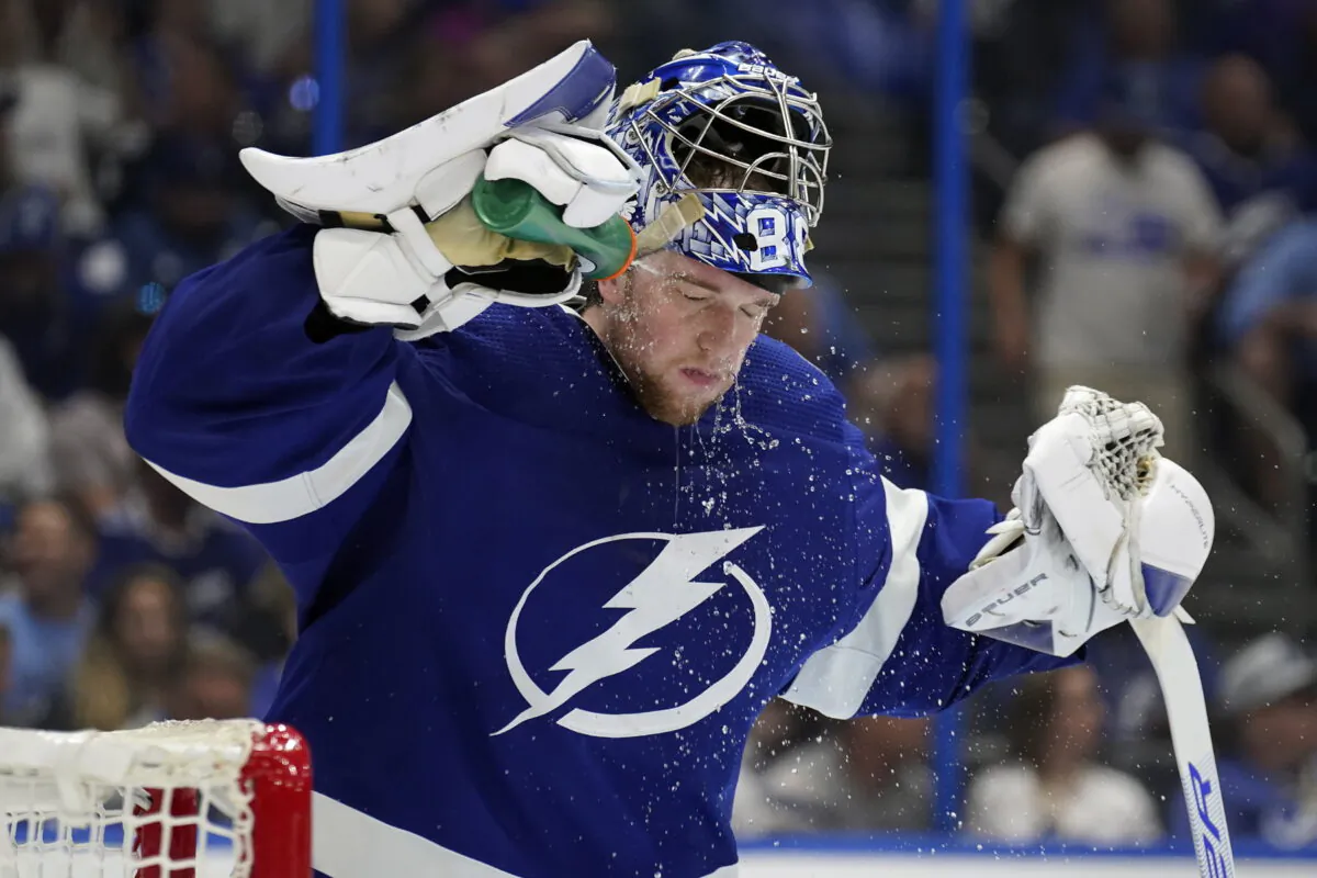 Tampa Bay Lightning goaltender Andrei Vasilevskiy (88) sprays water on his face during a timeout against the Florida Panthers during the third period in Game 4 of an NHL hockey second-round playoff series in Tampa, Fla., on May 23, 2022. (Chris O'Meara/AP Photo)