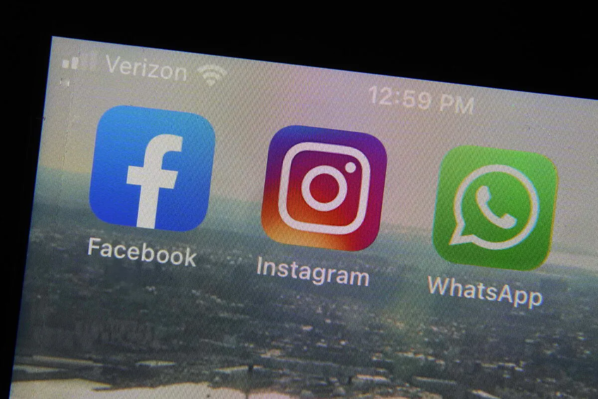 The mobile phone apps for Facebook (L), Instagram (C) and WhatsApp on a device in New York. (Richard Drew/AP Photo)