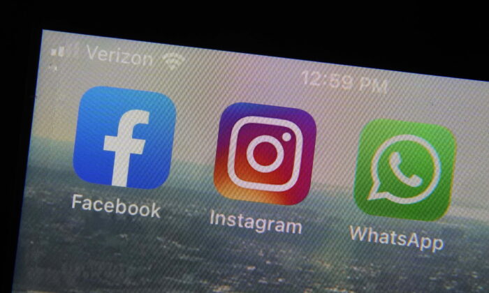 The mobile phone apps for Facebook (L), Instagram (C) and WhatsApp on a device in New York. (Richard Drew/AP Photo)