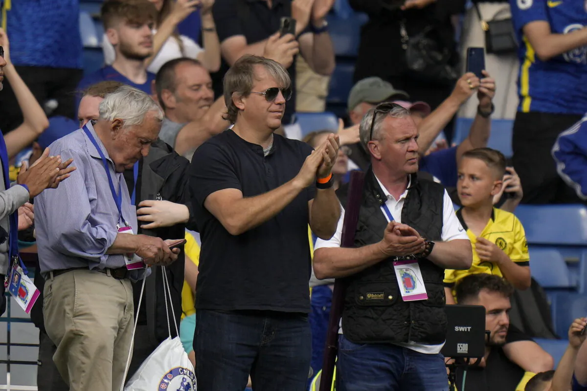 American businessman Todd Boehly (C) applauds as he attends the English Premier League soccer match between Chelsea and Watford at Stamford Bridge stadium in London on May 22, 2022. (Alastair Grant/AP Photo)