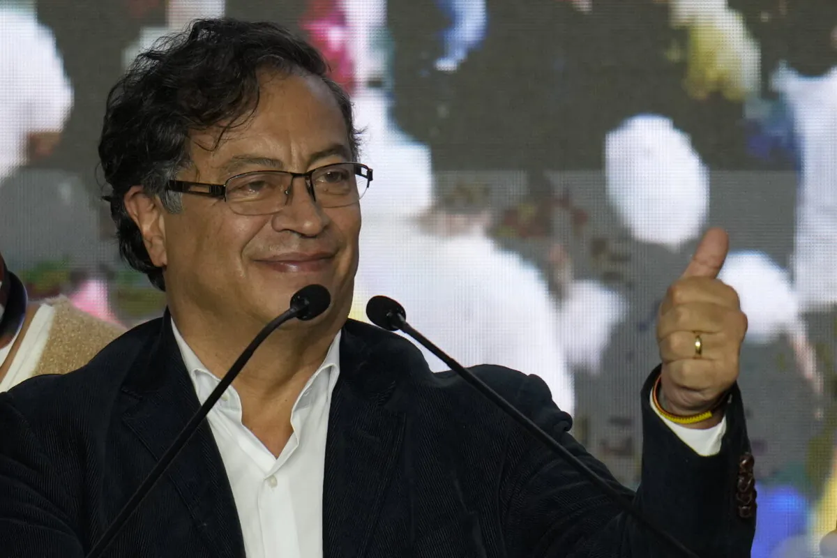 Presidential candidate Gustavo Petro, with the Historical Pact coalition, gives a thumbs-up to supporters on election night in Bogota, Colombia. May 29, 2022. (AP Photo/Fernando Vergara)
