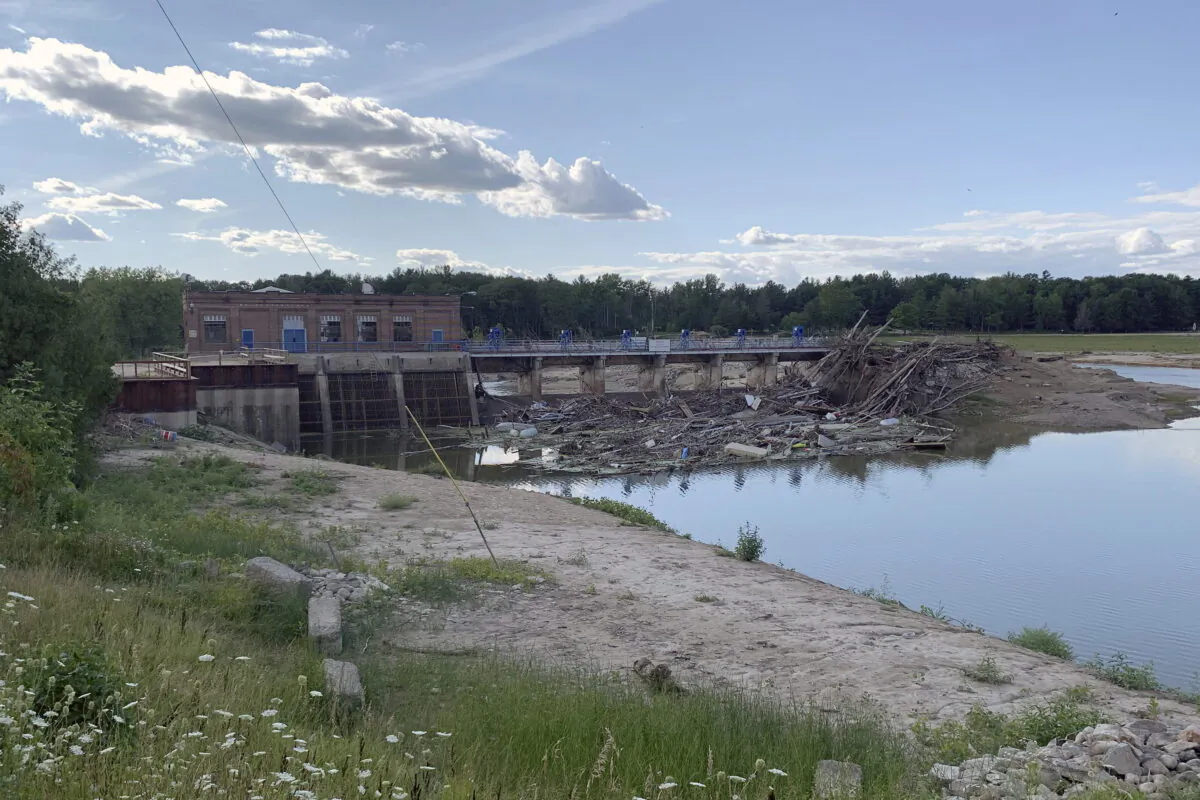 Debris rests at the spillway of the Sanford Dam in downtown Sanford, Mich., on July 30, 2020. (Jeff McMillan/AP Photo)