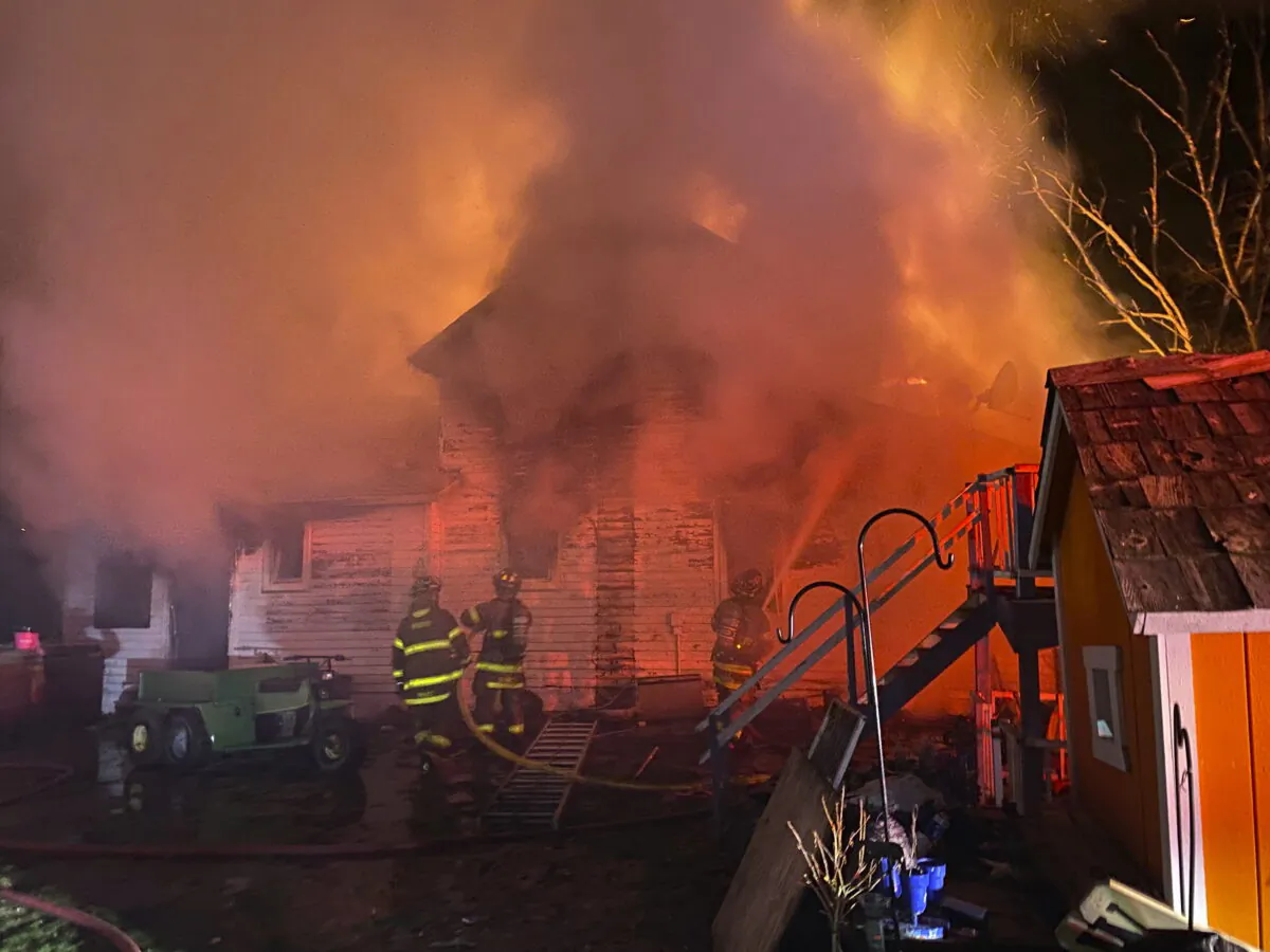 Firefighters work at the scene of a house fire that killed four people in Little Falls, Wis., on May 5, 2022. (Sparta Area Fire District via AP)