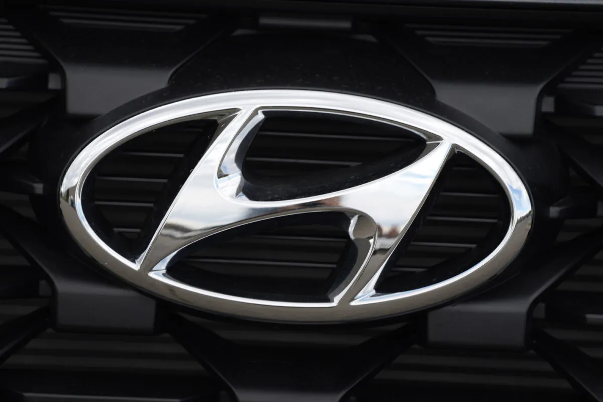 The Hyundai logo shines off the grille of an unsold vehicle at a Hyundai dealership in Littleton, Colo., on Sept. 12, 2021. (David Zalubowski/AP Photo)