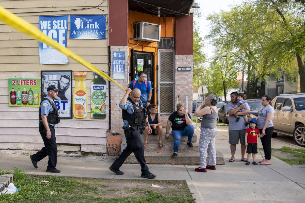Chicago police work the scene of a fatal shooting in the Back of the Yards neighborhood, in Chicago on May 10, 2022. (Tyler Pasciak LaRiviere/Chicago Sun-Times via AP)