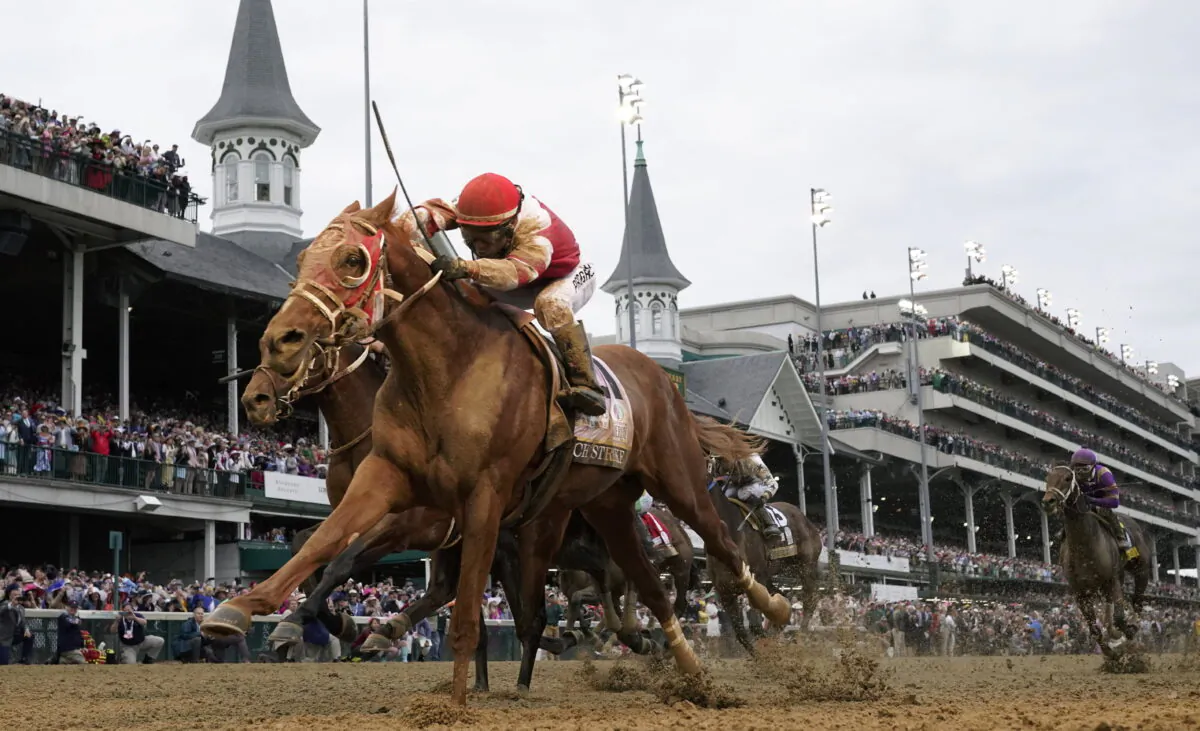 Rich Strike, with Sonny Leon aboard, crosses the finish line to win the 148th running of the Kentucky Derby horse race at Churchill Downs in Louisville, Ky. on May 7, 2022, (Jeff Roberson/AP Photo)