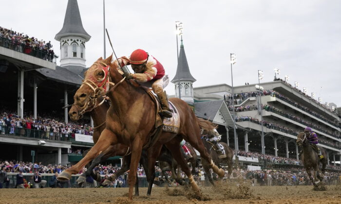 Rich Strike, with Sonny Leon aboard, crosses the finish line to win the 148th running of the Kentucky Derby horse race at Churchill Downs in Louisville, Ky. on May 7, 2022, (Jeff Roberson/AP Photo)