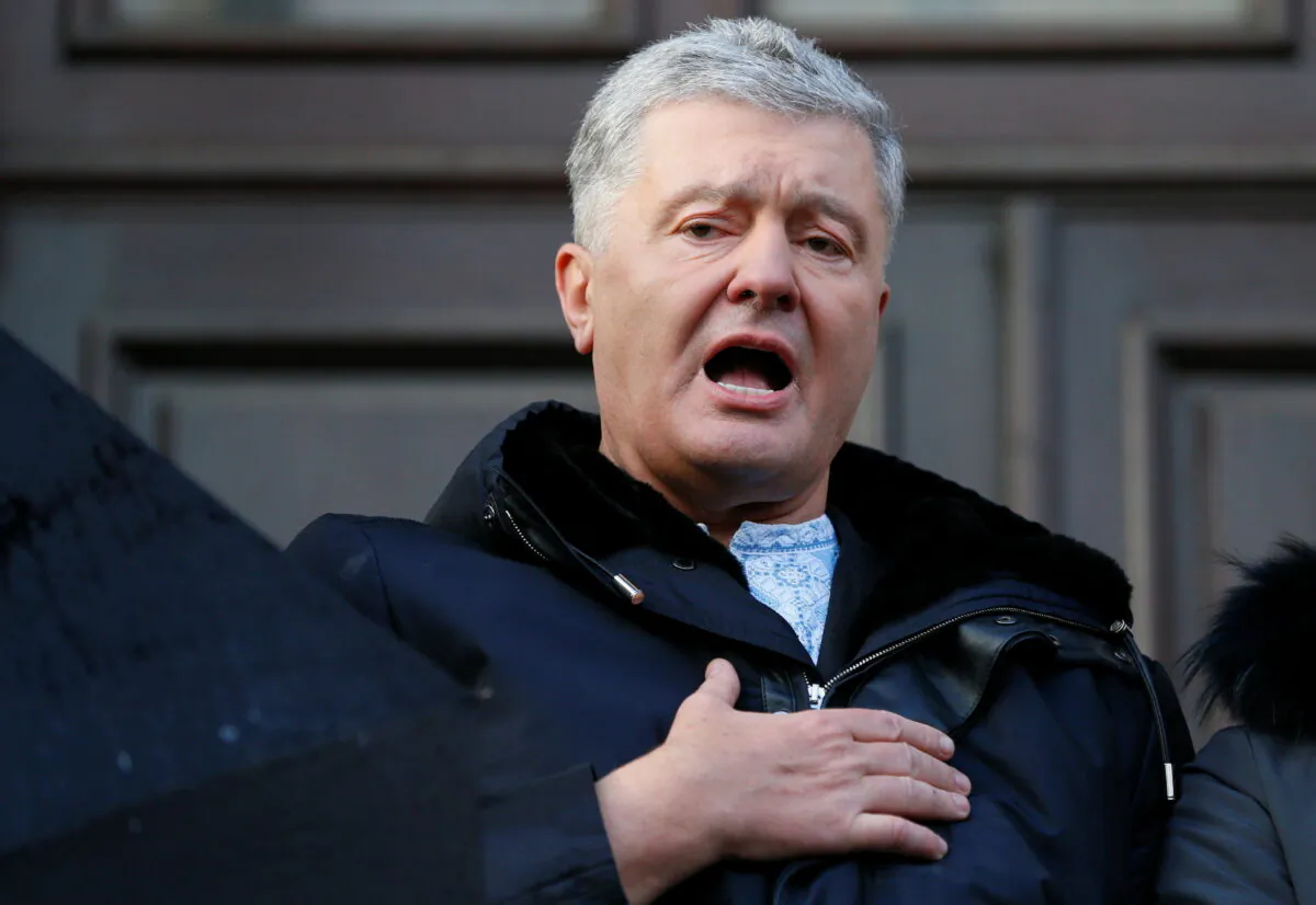 Ukrainian former President Petro Poroshenko, sings the national anthem after a court hearing in Kyiv, Ukraine, on Jan. 19, 2022. (Gleb Garanich/Reuters)