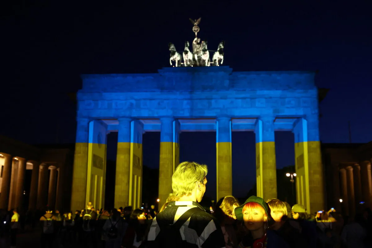 The Brandenburg Gate illuminated in the colours of the Ukrainian flag, following the Russian invasion, in Berlin, on May 9, 2022. (Lisi Niesner/Reuters)