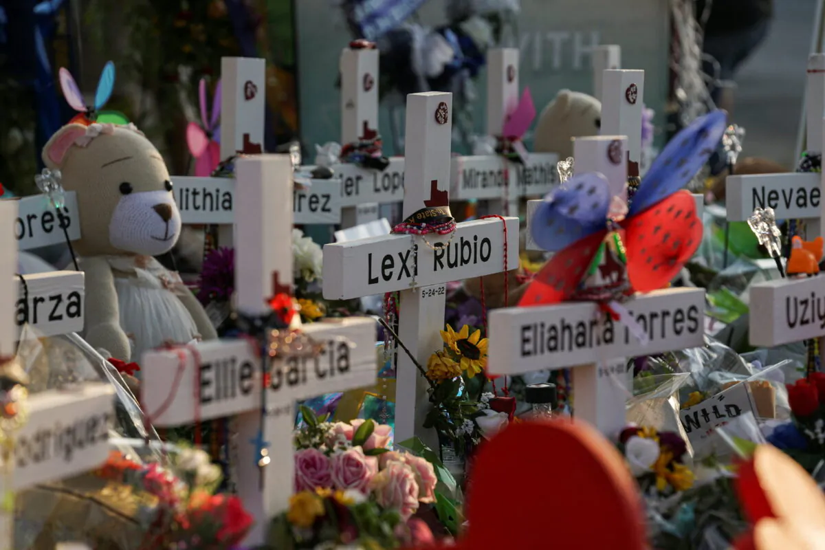 Flowers, toys, and other objects to remember the victims of the deadliest U.S. school mass shooting resulting in the death of 19 children and two teachers, at a memorial at Robb Elementary School in Uvalde, Texas, on May 30, 2022. (Veronica G. Cardenas/Reuters)