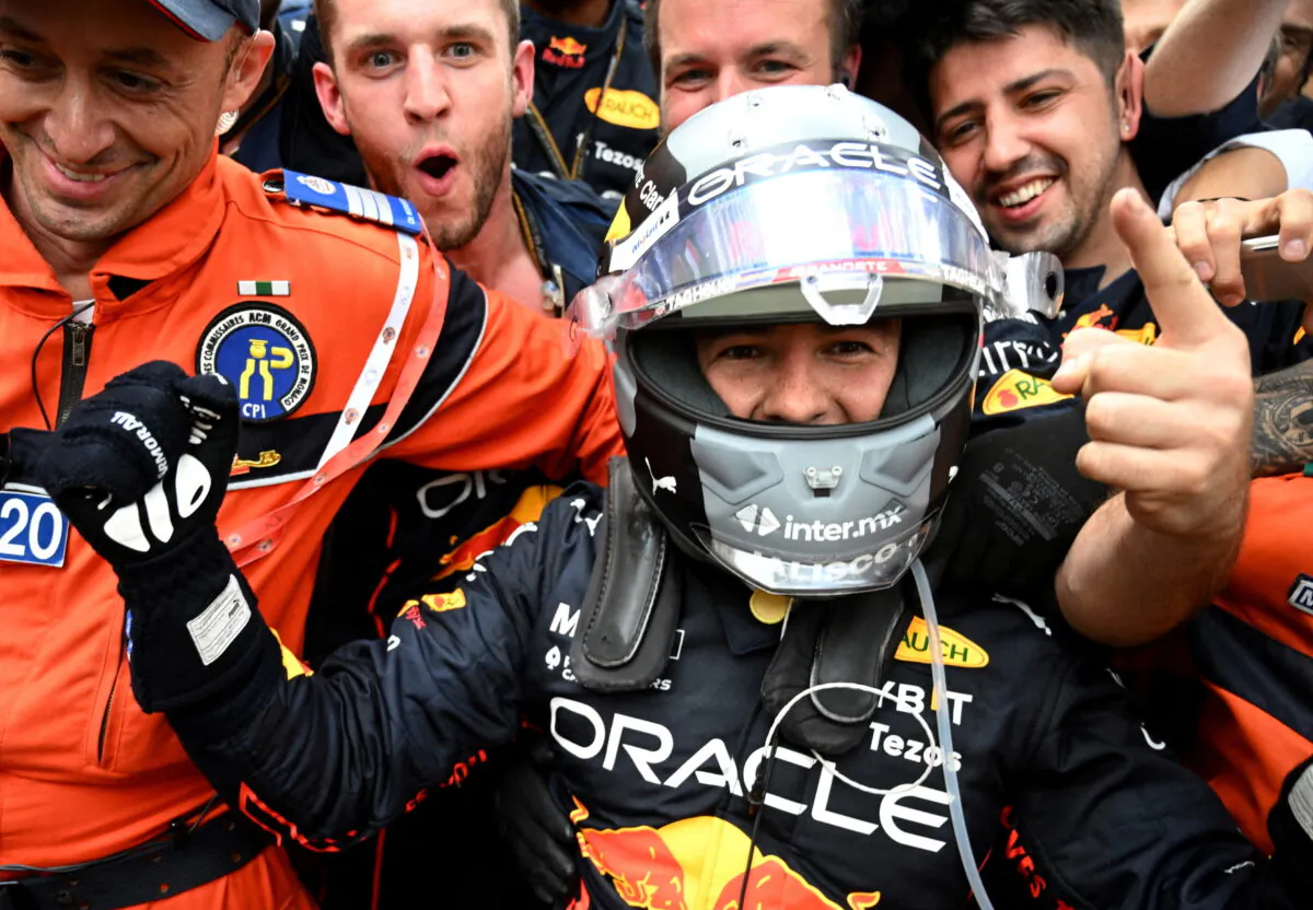 Red Bull's Sergio Perez celebrates with teammates after winning the race at F1 Grand Prix of Monaco in Monte-Carlo, Monaco, on May 29, 2022. (Christian Bruna/Pool via Reuters)
