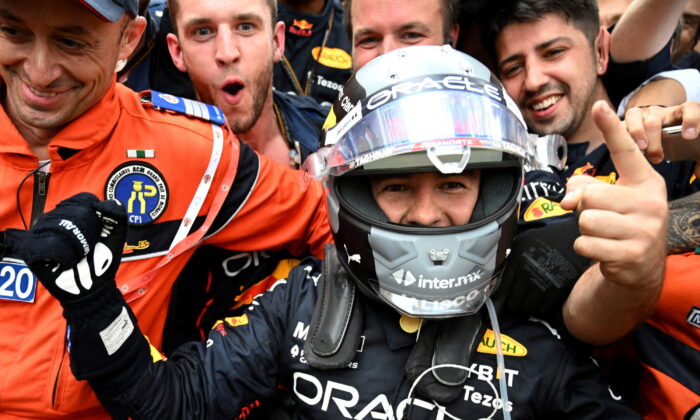 Red Bull's Sergio Perez celebrates with teammates after winning the race at F1 Grand Prix of Monaco in Monte-Carlo, Monaco, on May 29, 2022. (Christian Bruna/Pool via Reuters)