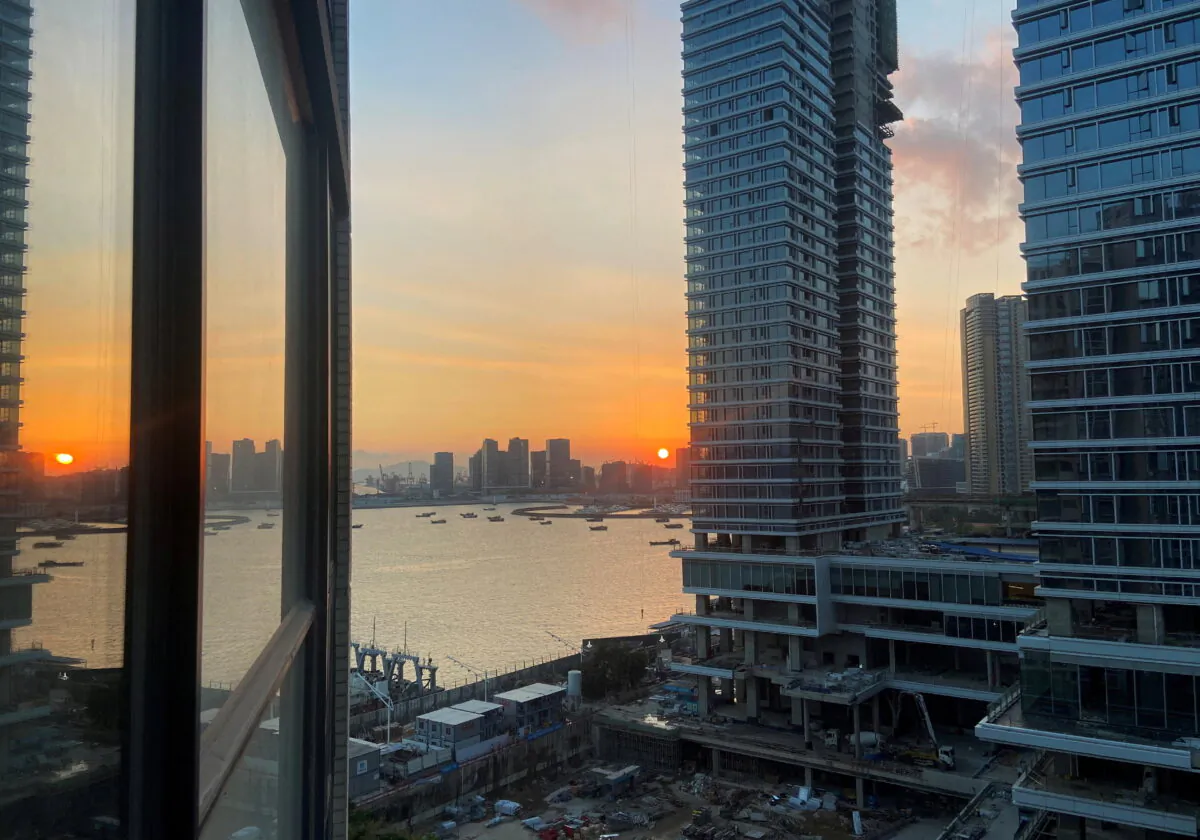 Under-construction apartments are pictured from a building during sunset in the Shekou area of Shenzhen, in Guangdong province, China, on Nov. 7, 2021. (David Kirton/Reuters)