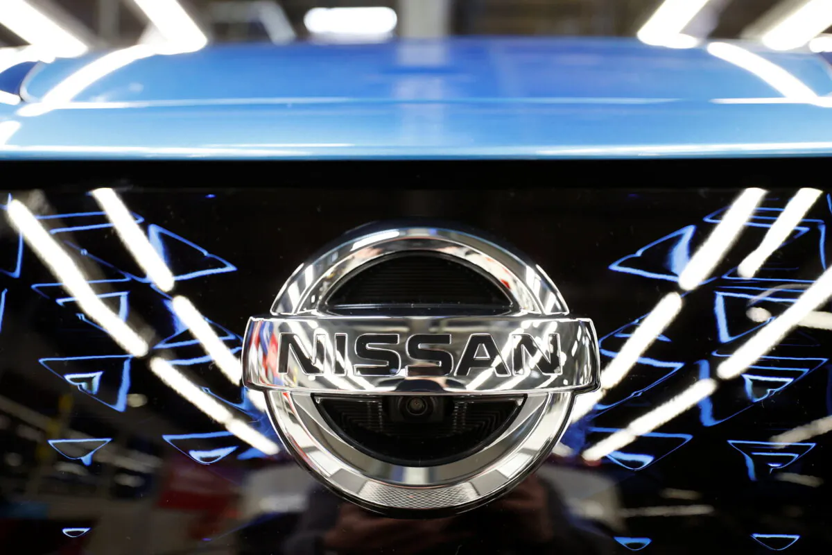 The logo of Nissan is seen on a car ahead of a news conference at Nissan's Sunderland plant in Sunderland, Britain, July 1, 2021. (Phil Noble/Reuters)