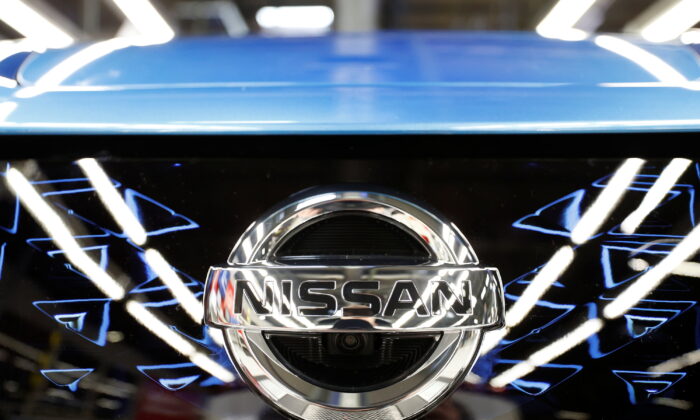 The logo of Nissan is seen on a car ahead of a news conference at Nissan's Sunderland plant in Sunderland, Britain, July 1, 2021. (Phil Noble/Reuters)
