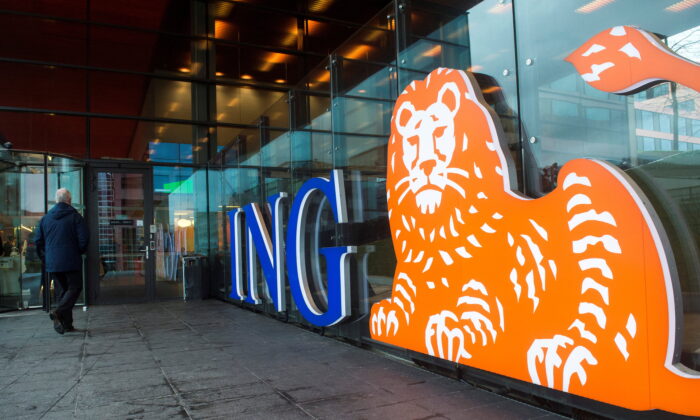 A man walks past the logo of ING Group NV at a branch office in Amsterdam, Netherlands, on Jan. 9, 2014. (Toussaint Kluiters/Reuters)