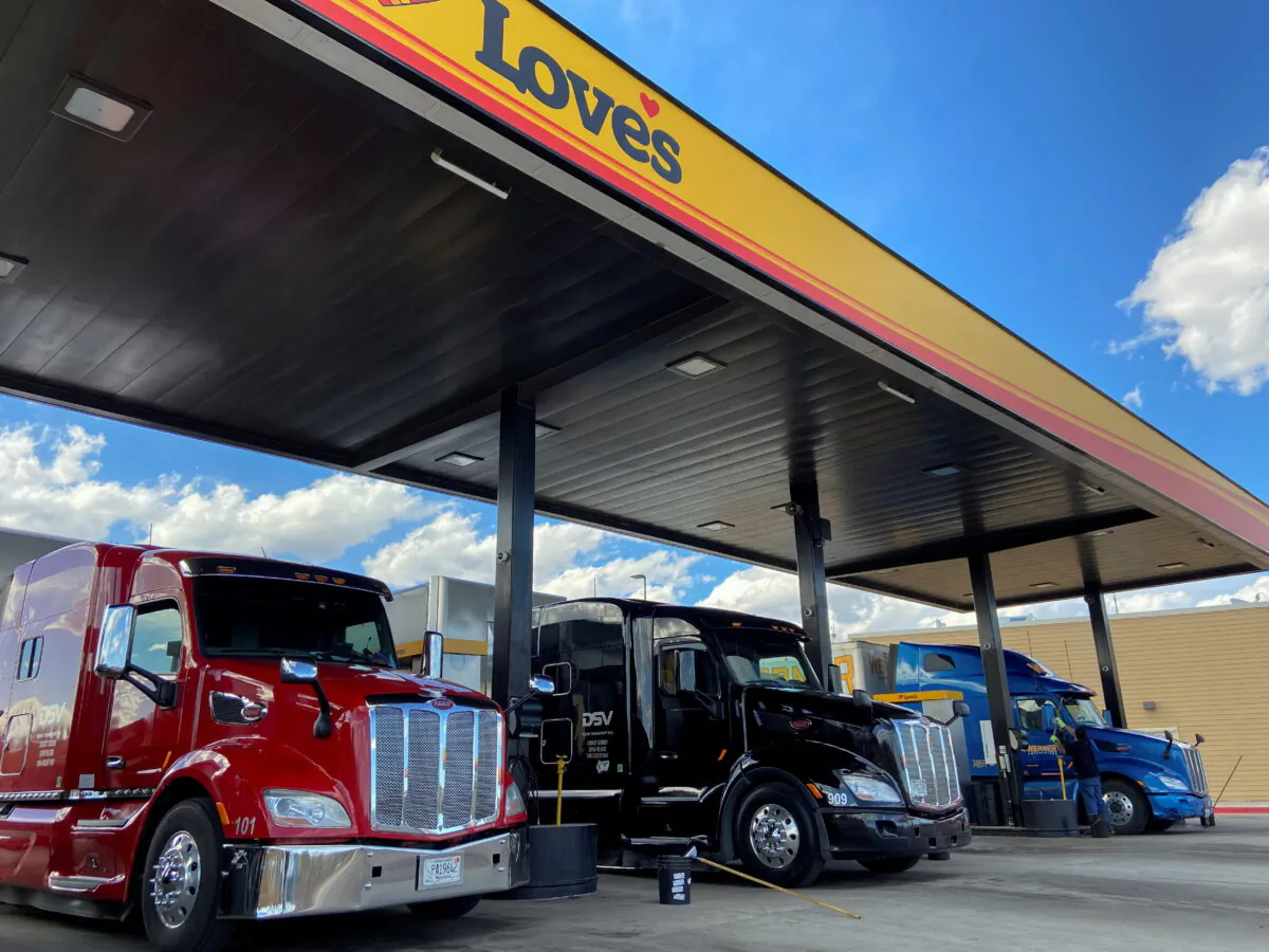 Trucks get refueled at a rest stop on March 23, 2020. (Andrew Hay/Reuters)