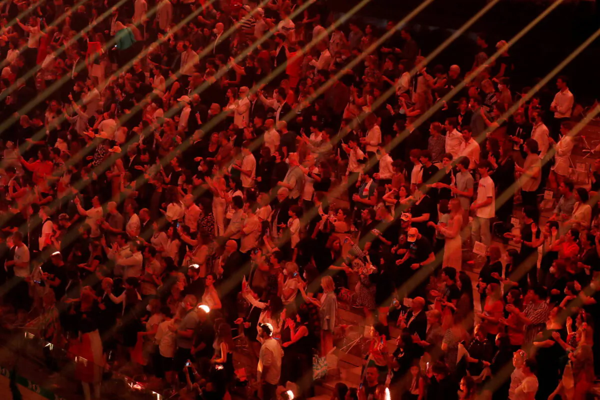 Spectators watch the final of the 2022 Eurovision Song Contest in Turin, Italy, on May 14, 2022. (Yara Nardi/Reuters)
