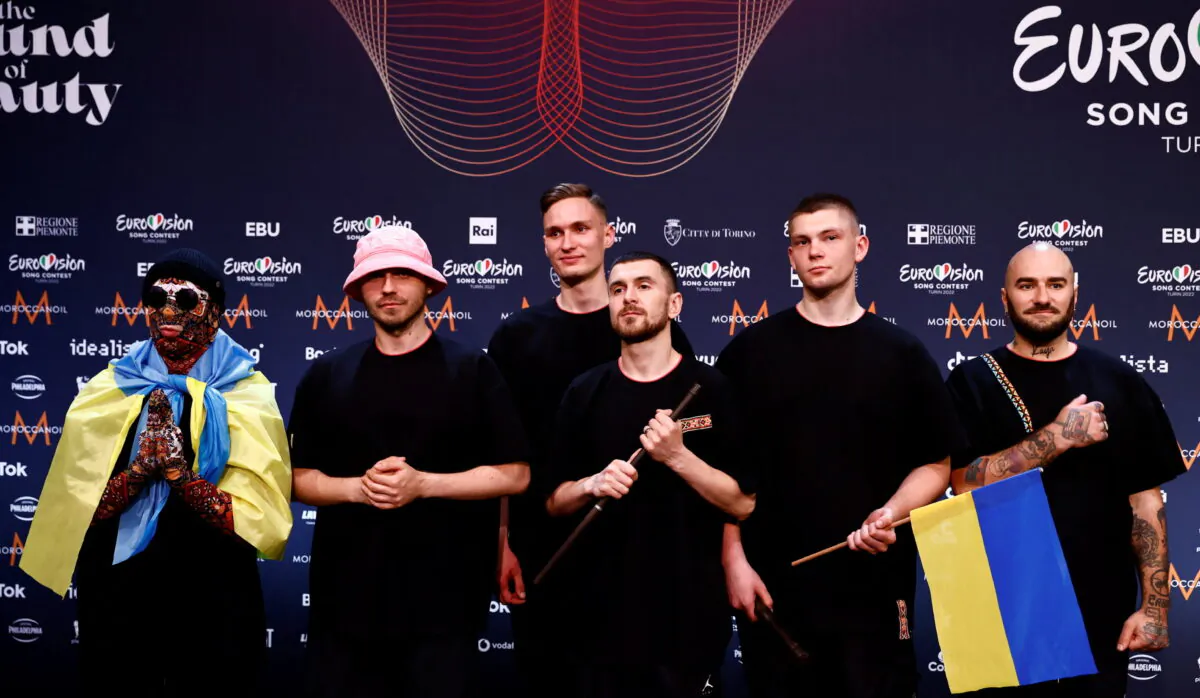 Kalush Orchestra from Ukraine pose for photographers after winning the 2022 Eurovision Song Contest, in Turin, Italy, on May 15, 2022. (Yara Nardi/Reuters)