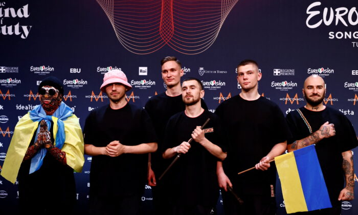 Kalush Orchestra from Ukraine pose for photographers after winning the 2022 Eurovision Song Contest, in Turin, Italy, on May 15, 2022. (Yara Nardi/Reuters)