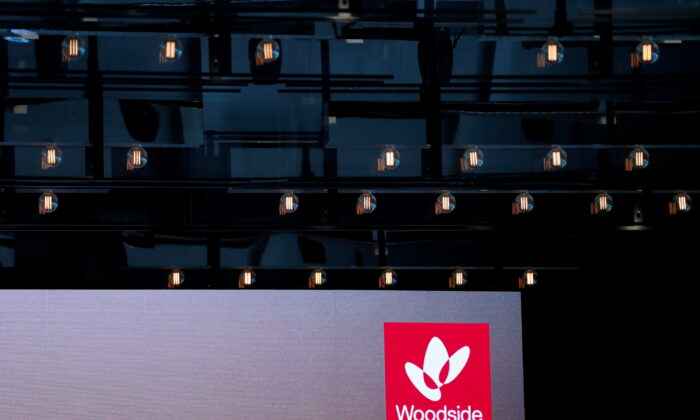 The logo for Woodside Petroleum, Australia's top independent oil and gas company, is projected onto a screen at a briefing for investors in Sydney, Australia, on May 23, 2018. (David Gray/Reuters)