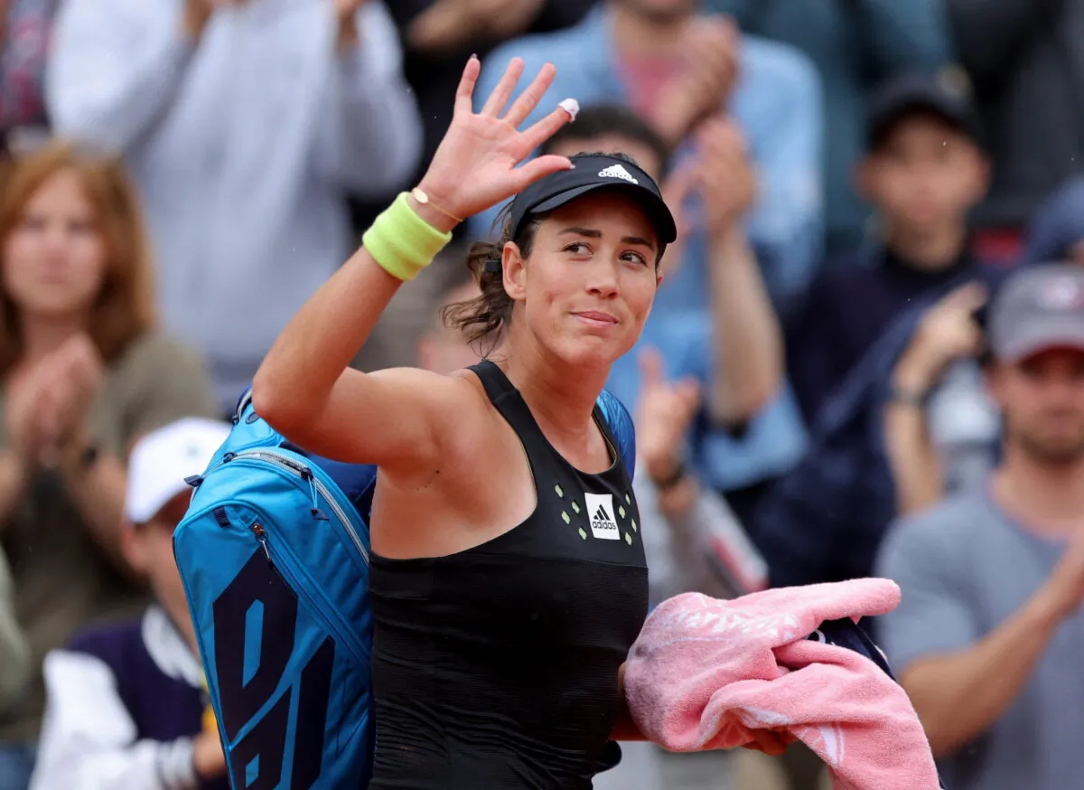 Spain's Garbine Muguruza exits the court after losing her first round match against Estonia's Kaia Kanepi at the French Open in Paris on May 22, 2022. (Pascal Rossignol/Reuters)