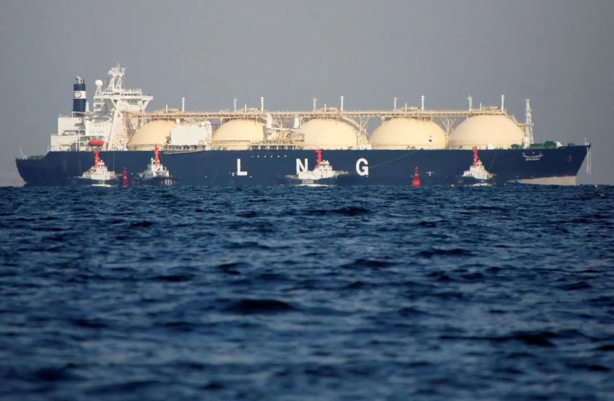 A liquefied natural gas (LNG) tanker is tugged towards a thermal power station in Futtsu, east of Tokyo, on Nov. 13, 2017. (Issei Kato/Reuters)