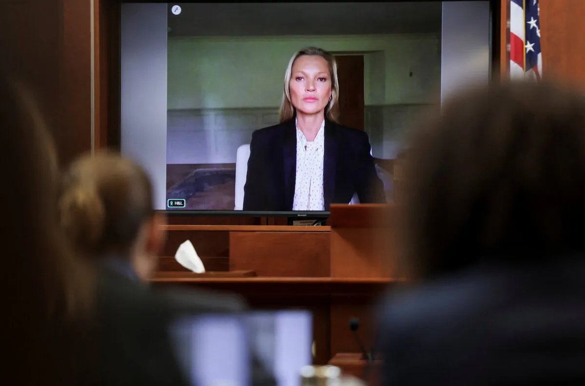 Model Kate Moss, a former girlfriend of actor Johnny Depp, testifies via video link during Depp's defamation trial against his ex-wife Amber Heard, at the Fairfax County Circuit Courthouse in Fairfax, Va., on May 25, 2022. (Evelyn Hockstein/Reuters)