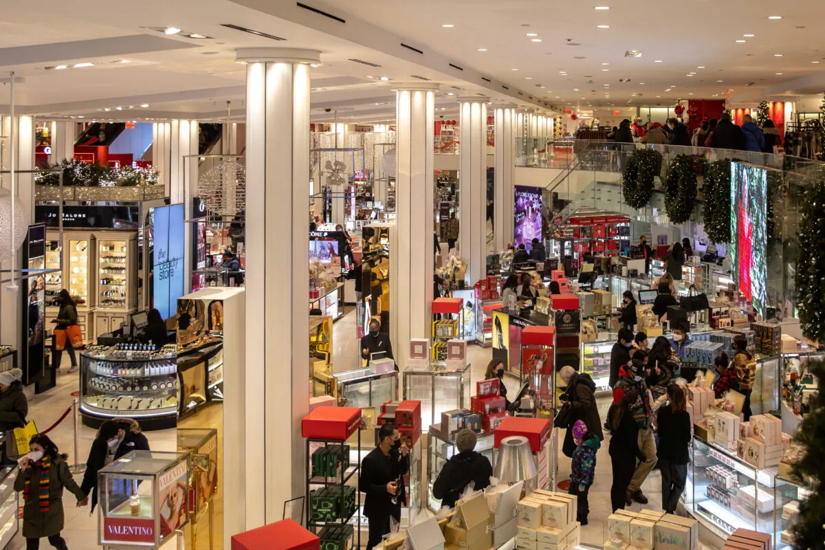 People wearing protective masks shop at Macy's Herald Square following the COVID-19 outbreak in the Manhattan borough of New York on Dec. 26, 2020. (Jeenah Moon/Reuters)