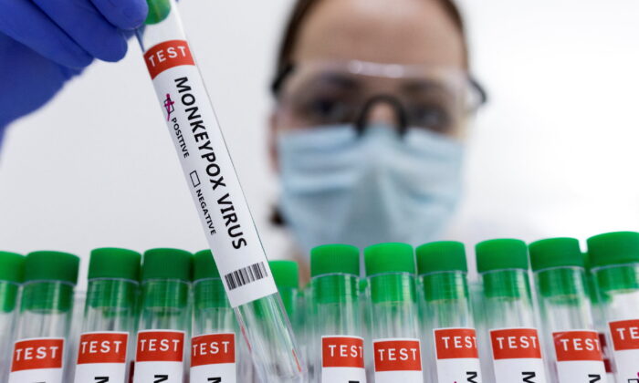 Test tubes labelled "Monkeypox virus positive" in an illustration taken on May 23, 2022. (Dado Ruvic/Reuters)