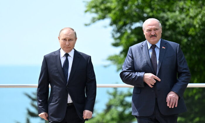 Russian President Vladimir Putin and Belarusian President Alexander Lukashenko walk during a meeting in Sochi, Russia, on May 23, 2022. (Sputnik/Ramil Sitdikov/Kremlin via Reuters) 