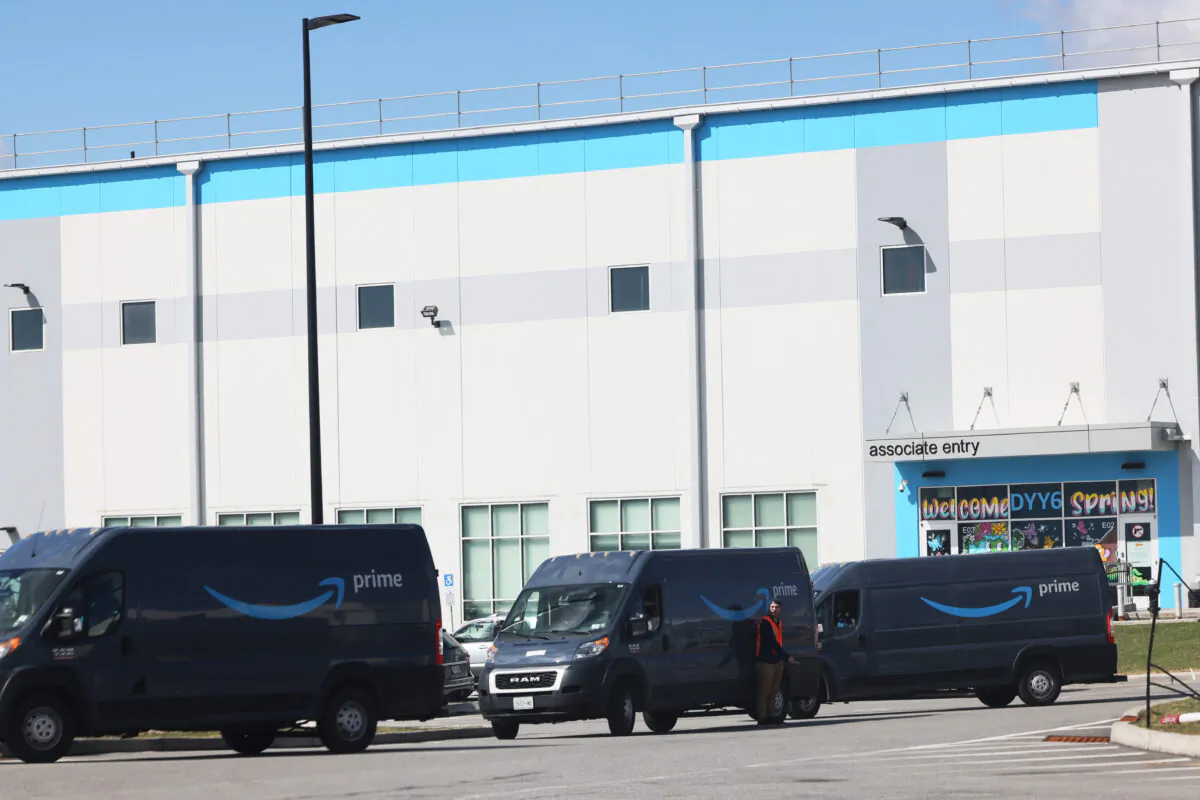 Amazon delivery vans are leaving the Amazon's JFK8 Staten Island fulfillment center in Staten Island in New York, on March 25, 2022. (Michael M. Santiago/Getty Images)